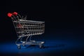 Mini Shopping Cart Trolly (empty) on a Lush Dark Blue Gradient Background Royalty Free Stock Photo