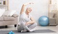 Active senior woman doing exercises at home Royalty Free Stock Photo