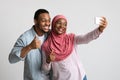 Positive african american couple taking selfie on mobile phone Royalty Free Stock Photo