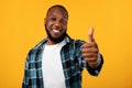 Positive African American Guy Gesturing Thumbs Up, Studio Shot