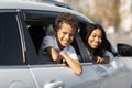 Positive african american mom and child looking from car windows Royalty Free Stock Photo