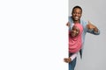 Positive african american muslim couple with empty board