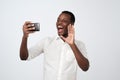 african man making selfie on his gadget, electronic, device, holding smart phone in hand and having video call Royalty Free Stock Photo