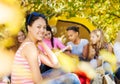 Positive Asian girl sitting near yellow tent