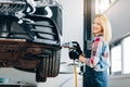 Positive awesome girl holding impact wrench