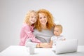 Positive awesome woman sitting between her children