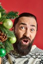 positive bearded man in winter sweater