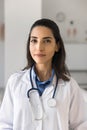 Positive beautiful young practitioner woman vertical portrait