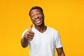 Positive Black Man Gesturing Thumbs Up Standing Over Yellow Background Royalty Free Stock Photo