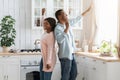 Positive Black Millennial Couple Dancing In Kitchen Together, Having Fun At Home Royalty Free Stock Photo