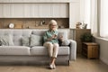 Positive blonde senior woman in glasses using tablet computer Royalty Free Stock Photo