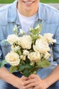 Positive boy holding flowers Royalty Free Stock Photo