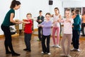 positive boys and girls rehearsing ballet dance in studio Royalty Free Stock Photo