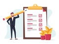 Positive business man with a giant pencil on his shoulder nearby marked checklist on a clipboard paper. Royalty Free Stock Photo