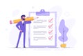 Positive business man with a giant pencil on his shoulder nearby marked checklist on a clipboard paper. Successful completion of Royalty Free Stock Photo