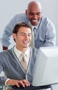 Positive business partners working at a computer Royalty Free Stock Photo
