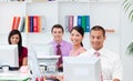 Positive business people working at computers Royalty Free Stock Photo