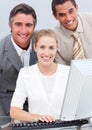 Positive business team working at a computer Royalty Free Stock Photo