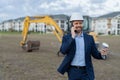 positive businessman construction investor with phone. businessman construction investor