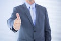 positive businessman smiling with thumb up Royalty Free Stock Photo