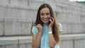 Businesswoman having conversation on smartphone outside.Girl celebrating victory Royalty Free Stock Photo