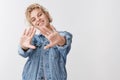 Positive carefree good-looking european woman wearing denim jacket stretch hands forward encouraged lots plans future Royalty Free Stock Photo
