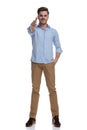 Positive casual man holding finger gun