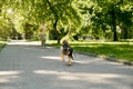 Positive boy and german shepherd puppy running in park Royalty Free Stock Photo