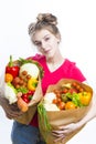 Positive Caucasian Girl Posing With Eco Shopping Bag Filled With Vegetables. Vertical Image Composition