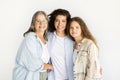 Positive caucasian teen girl, mature mom and senior woman hugging Royalty Free Stock Photo