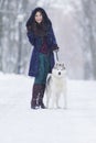 Positive Caucasian Woman Airing Her Husky Dog