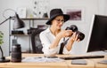 Photographer viewing pictures at office