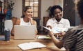 Positive changes come from a collaborative work culture. a group of young businesswomen having a meeting in a modern