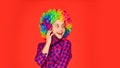 Positive and cheerful. childhood happiness. kid looking funny in rainbow wig hair. hair dyeing at hairdresser. child Royalty Free Stock Photo