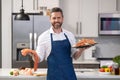 positive chef cooking lobster and salmon seafood. chef with lobster and salmon seafood