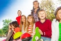 Positive children with skateboards and helmets