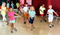 Positive children studying modern style dance  in class indoors Royalty Free Stock Photo