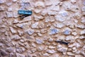 Positive concept. Natural stone wall. Exposed wall of an old house with a charred piece and a sign with a positive message Royalty Free Stock Photo