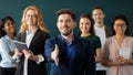 Positive confident male hr extending hand greeting new staff member