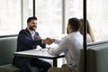 Positive confident young Indian lawyer in formal suit giving consultation Royalty Free Stock Photo