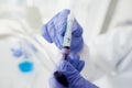 Coronavirus test in hands in protective gloves