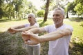 Elderly couple stretching arms stock photo Royalty Free Stock Photo