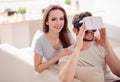 Positive couple using virtual reality device Royalty Free Stock Photo