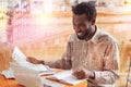 Positive delighted Afro-American making notes Royalty Free Stock Photo