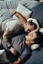 Positive delighted non-traditional couple sleeping together Royalty Free Stock Photo