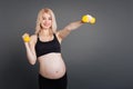 Positive delighted pregnant woman while training Royalty Free Stock Photo