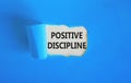Positive discipline symbol. Concept words Positive discipline on beautiful white paper. Beautiful blue paper background. Business