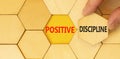 Positive discipline symbol. Concept words Positive discipline on beautiful wooden puzzles. Beautiful yellow paper background.