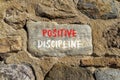 Positive discipline symbol. Concept words Positive discipline on beautiful big stone. Beautiful stone wall background. Business Royalty Free Stock Photo