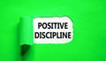 Positive discipline symbol. Concept words Positive discipline on beautiful white paper. Beautiful green paper background. Business